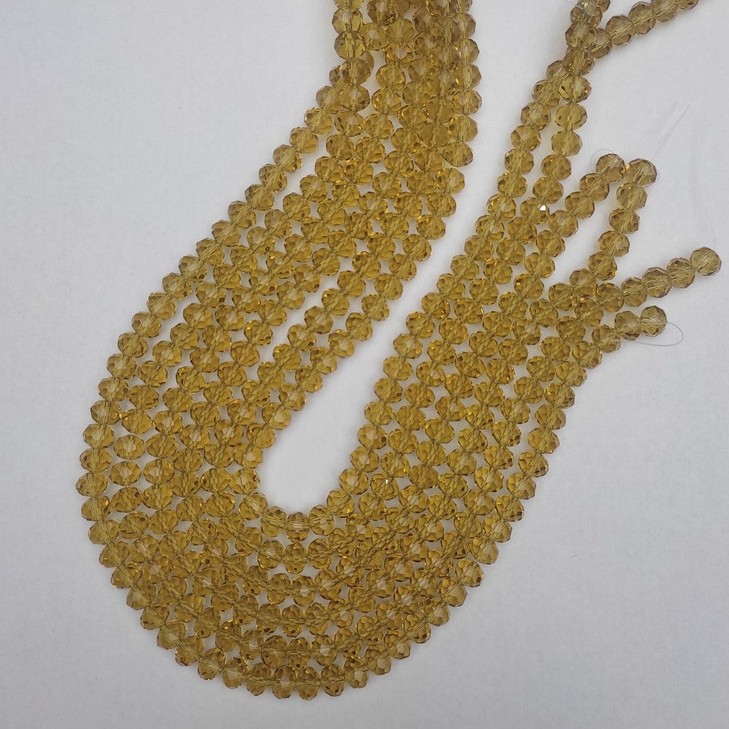 Mărgele cehești cristal transparente în nuanța șampanie, tăiate, rondel, diametrul 8x6 mm, lungime 40 mm +/- pe fir