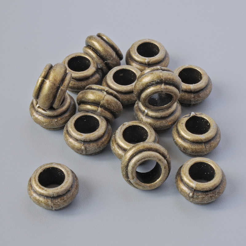 Furnitură pentru mărgele – inserție, diametru 9×5,5 mm, diametrul orificiului 4,7 mm, ambalaj 16 buc. +/-, culoare bronz a metalului