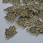 Furnitură pentru pandantiv «Hamsa», diametru 21×15 mm, diametrul găurii 1,7 mm, ambalaj 24 buc. ±, culoare bronz metalic