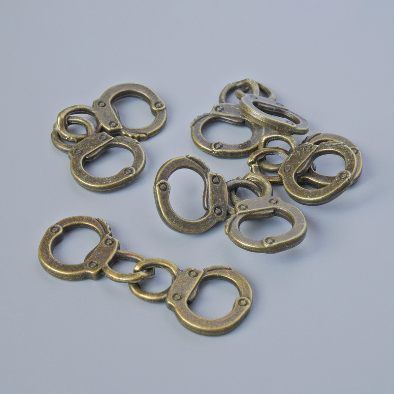 Furnitură pandantiv «Cătușe», diametrul 17×11,5 mm, lungimea 31 mm, set 5 bucăți ±, culoare bronz metalic