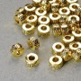 Furnitură mărgea-inserație, diametrul 3,5×6 mm, gaură de diametru 2,6 mm, culoare auriu a metalului, ambalaj 20 g, 38 buc.