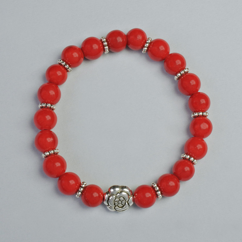 Brățară din coral (presat) – bile netede, diametrul de aproximativ 8 mm, lungimea 18 cm, cu inserții metalice