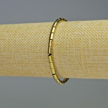 Brățară din hematit cilindric, culoare aurie, diametru 6×4 mm, lungime 18 cm, pe elastic