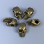 Mărgea-inserație în formă de craniu, culoare bronz, dimensiuni 12×18×8 mm, gaură 4 mm, ambalaj 20 g (~5 buc.)