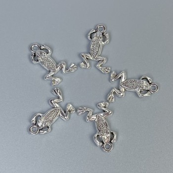 Pandantiv broscuță, culoare argintie, dimensiuni 20x13x3 mm +/- gaură de 1,5 mm +/- ambalare 20 g (~18 buc.)