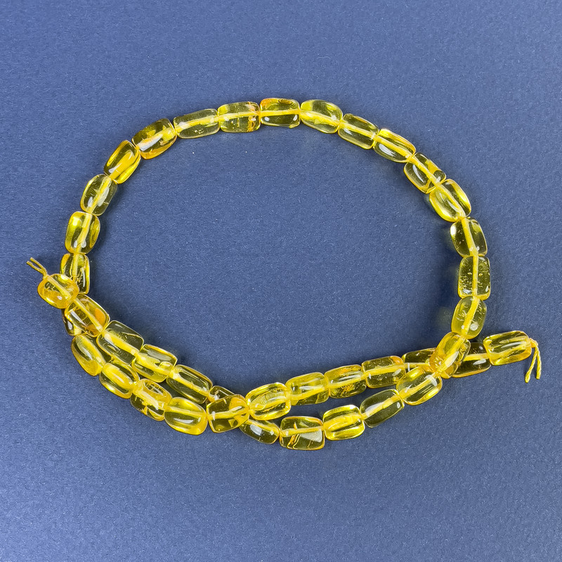Mărgele din chihlimbar fațetate 10×7mm pe șnur