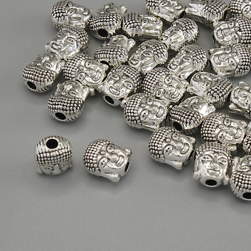 Inserție Buddha argintiu, mărgea 6×7×4 mm, gaură Ø 1,9 mm, ambalaj 20 g (~31 buc.)