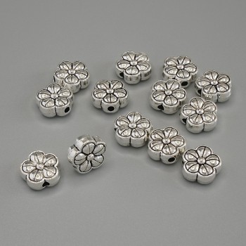 Mărgea-inserție «Floare», în nuanță argintie, diametru 10×4,5 mm, gaură de aproximativ 2 mm, ambalaj 20 g (~13 buc.)