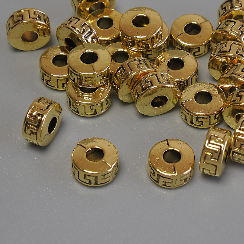 Furnitură: inserție mărgea, culoare metalică aurie, diametrul 7×4 mm, gaură de circa 2,9 mm, ambalaj 20 g (~25 buc.)