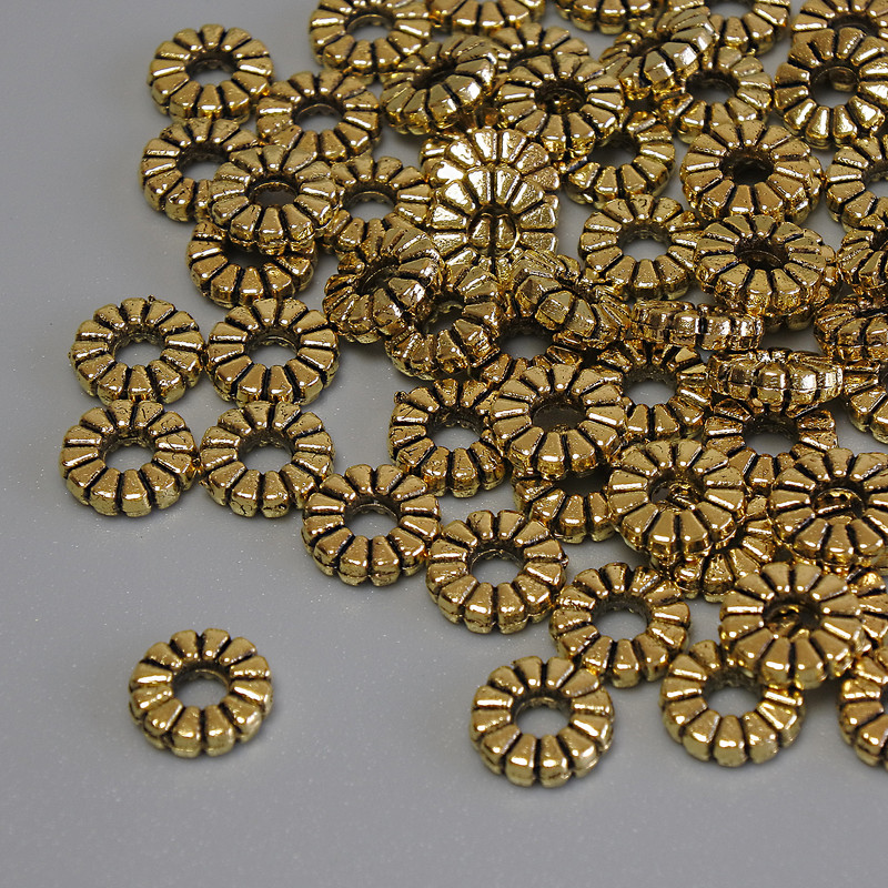 Inserții pentru mărgele, culoare metalică aurie, diametru 7×2 mm, gaură ~2,5 mm, ambalaj 20 g (~67 buc.)