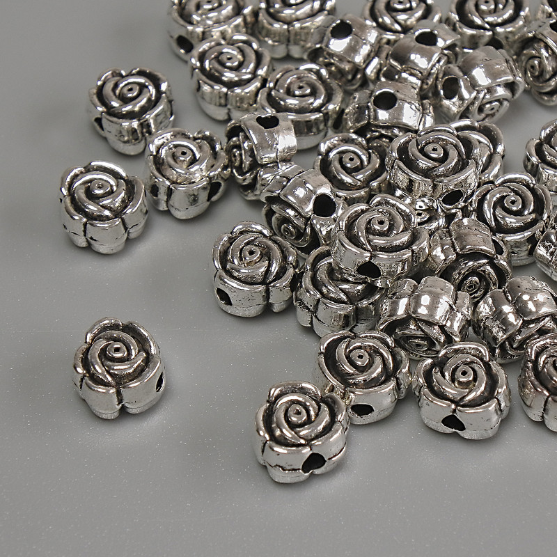 Inserție - mărgea Floare, culoare argintiu, diametru 6×4 mm, gaură ~1,7 mm, ambalaj 20 g (~37 buc.)