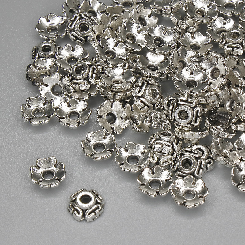 Capace pentru mărgele, culoare argintie, diametru 6,5×1 mm, orificiu de aproximativ 1,8 mm, ambalare 20 g (~88 buc.)