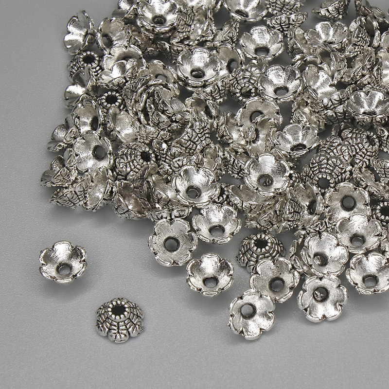 Capace pentru mărgele, culoare argintie, diametru 6×1 mm ± gaură de 1,5 mm ± ambalare 20 g (~122 buc.)