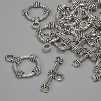 Închizătoare toggle, diametrul 19,5×3,5 mm, cerc cu diametrul aproximativ 14 mm, diametrul orificiului aproximativ 9 mm, culoare argintie a metalului, fatovka 11 buc.