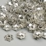 Capace pentru mărgele, diametru 7 mm +- gaură de 2,5 mm +-, culoare argintie a metalului, ambalaj de 20 g +- (~127 buc.)