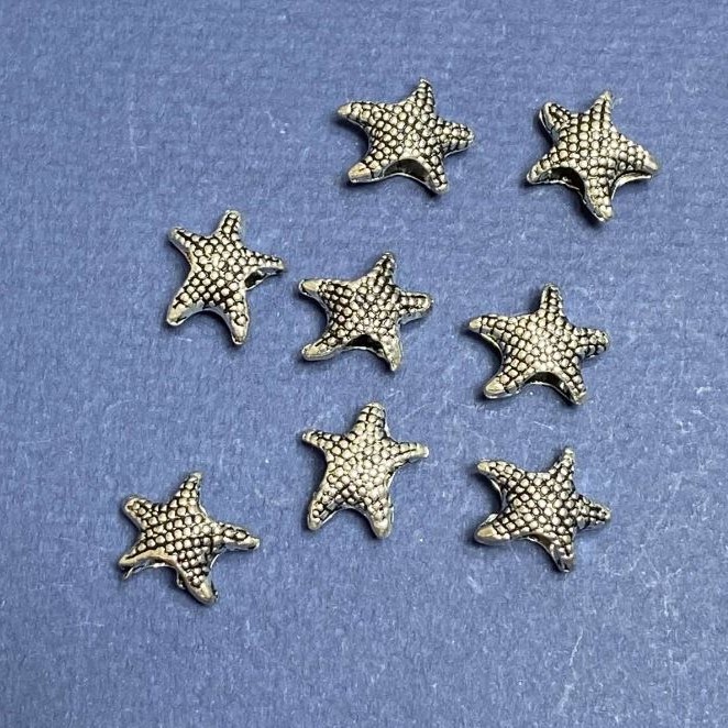 Mărge Pandora – Șarm Stea de mare 14x13 mm, lot 20 g, +/- 15 buc.