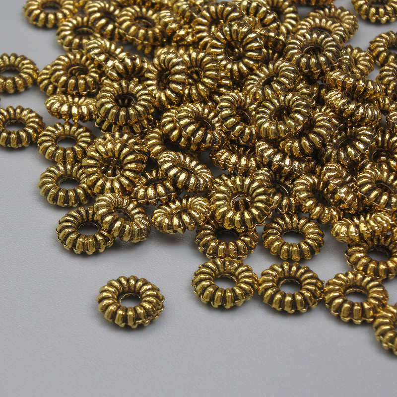 Mărgele-inserție aurii, culoare metalică aurie, diametru 6×2 mm, gaură 2 mm, ambalare 20 g (~94 buc.)