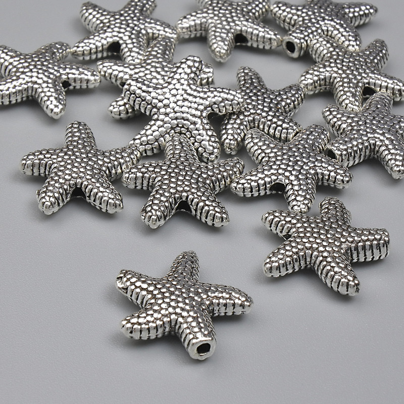Mărgea-inserație Stea de mare, culoare argintie, diametru 14 mm, gaură 1,5 mm, ambalaj 20 g (~14 buc.)