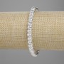 Brățară din lavă cu luciu metalic argintiu, rondel poros 6×4,5 mm, lungime 18 cm, pe elastic