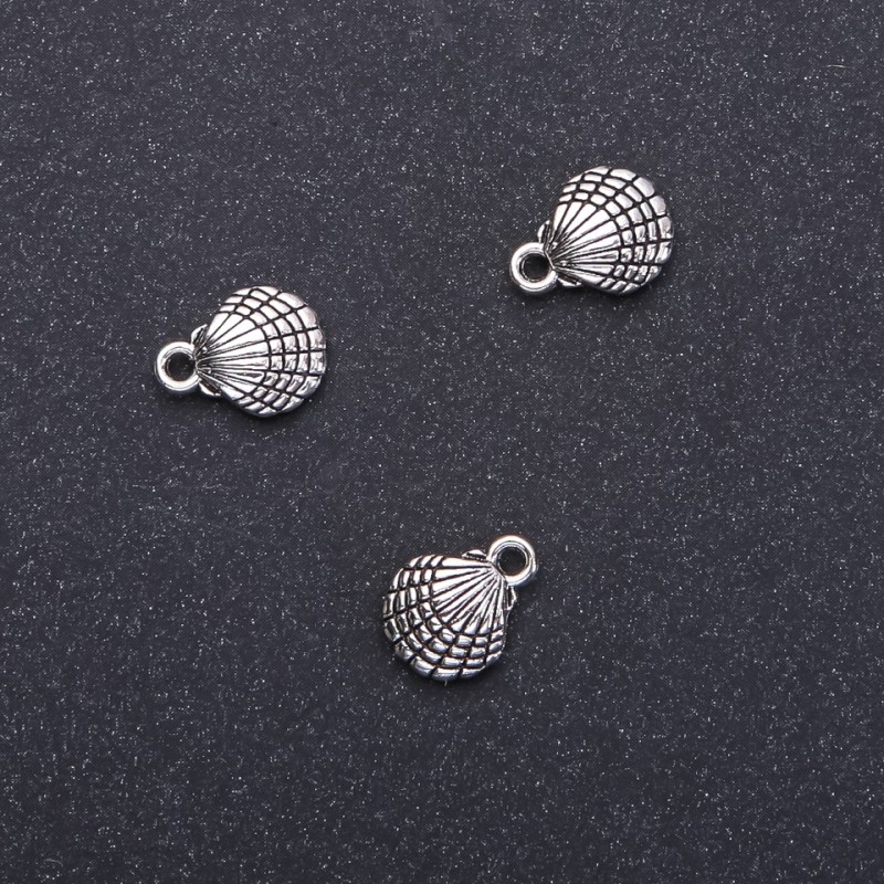 Furnitură pentru pandantiv scoică, diametrul 10 mm, lungimea 13 mm, diametrul găurii 1,5 mm, ambalaj 20 g, 18 buc. (±)