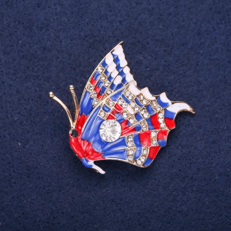 Broșă Fluture cu strasuri albe, email albastru și roșu, 40×38 mm, metal galben