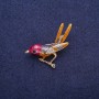 Broșă pasăre pe creangă email cu strasuri, metal auriu 34x33 mm