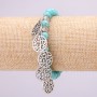 Brățară turcoaz pe elastic, diametrul 8(±)mm, lungimea 18 cm, cu inserturi și pandantive