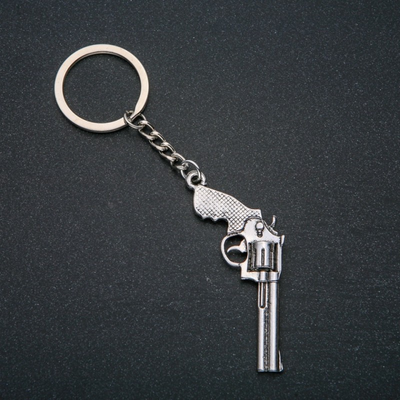 Breloc „Revolver”, diametrul 62×28 mm, lungime 12 cm, metal argintiu