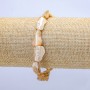 Brățară elastică, sidef natural bej. Sidef tăiat, diametrul aproximativ 15×12 mm, lungime 18 cm.