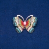Reducere! Broșă cu formă de fluture, metal auriu, strasuri multicolore și mărgea 34x45mm +