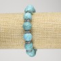Brățară turcoaz (artificială) pe elastic, diametrul 12 mm ±, cu strasuri albe, lungime 18 cm+