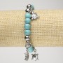 Brățară turcoaz sintetică pe elastic, diametrul aproximativ 8 mm, cu inserții argintii și țestoase decorative, lungimea 18 cm+