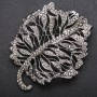 Broșă în formă de frunză, cu strasuri negre, culoarea metalului «argint închis» 58×72 mm