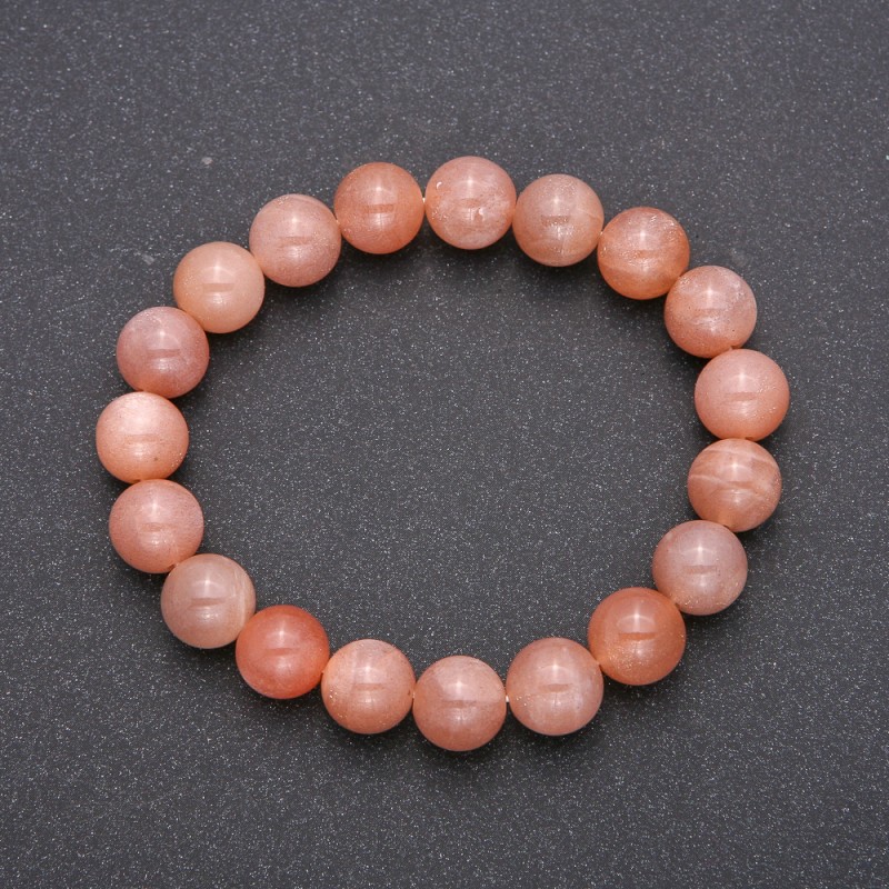 Brățară din selenit natural pe elastic, cu bile netede, diametru aproximativ de 10 mm, circumferința 18 cm