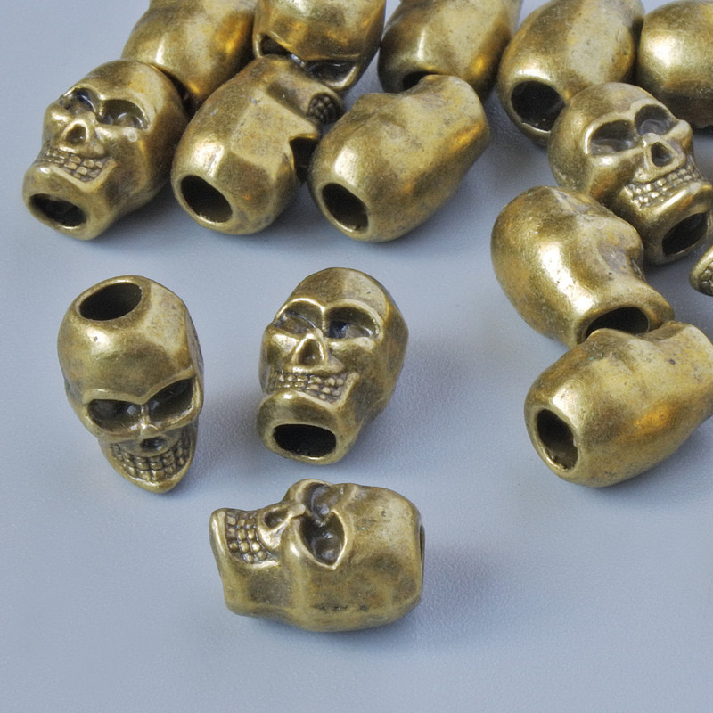 Furnitură pentru mărgele - inserție «Craniu», diametrul 9×6 mm, diametrul găurii 2,6 mm, set 18 buc ± culoare bronz a metalului