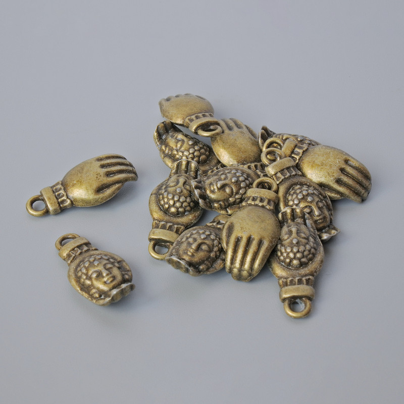 Furnituri pandantiv „Palma Buddha”, dimensiuni 18×8,5 mm, diametrul găurii 2 mm, ambalaj 13 buc. ±, culoare bronz a metalului