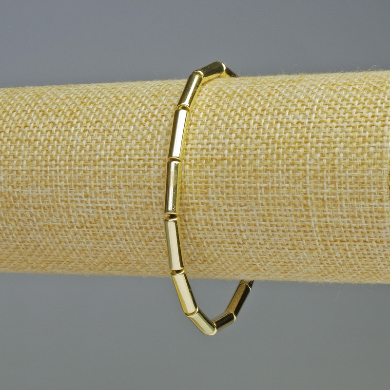 Brățară din hematit cilindric, culoare aur deschis, diametrul 13×4 mm, lungimea 18 cm, elastică