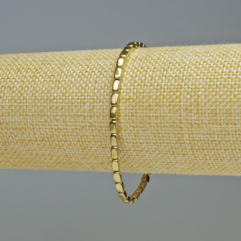 Brățară din hematit, formă ovală dreptunghiulară, culoare aurie, diametrul 3x5 mm, lungime 18 cm, pe elastic