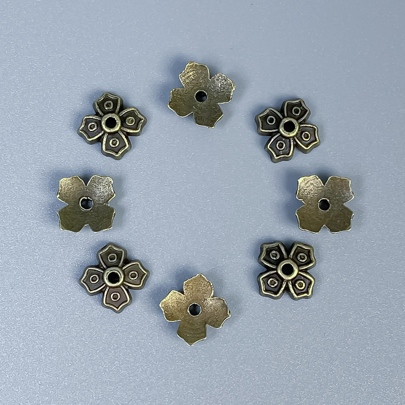 Capace pentru mărgele, culoare bronz, diametru aproximativ 7x1 mm, gaură de aproximativ 1 mm, ambalaj 50 buc