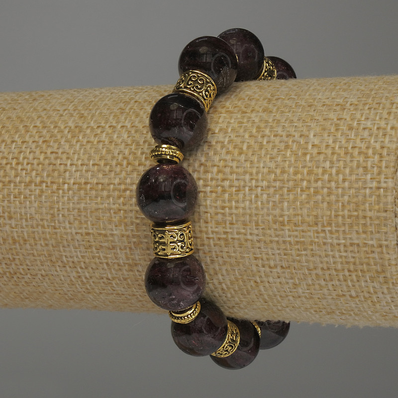 Brățară din granat cu bile netede, diametru aproximativ 12 mm, cu inserții metalice, lungime 18 cm, pe bază elastică