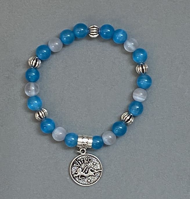 Brățară asortată «Ochi de pisică» cu bile netede de 8 mm ±, cu inserții metalice, lungime 18 mm ±, pe elastic