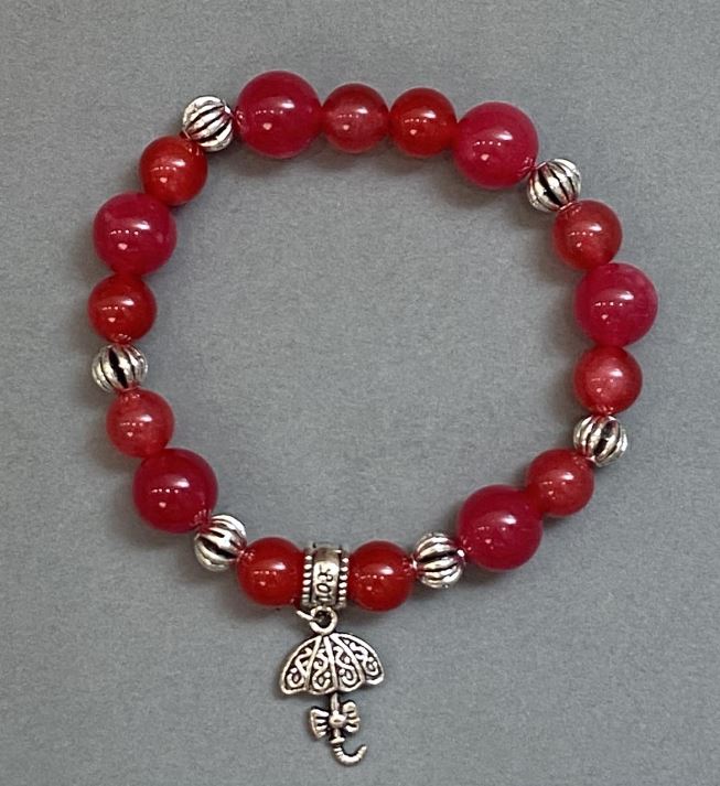 Brățară din turmalin cu bile netede de 8–10 mm, cu inserții metalice, lungime 18 cm, extensibilă