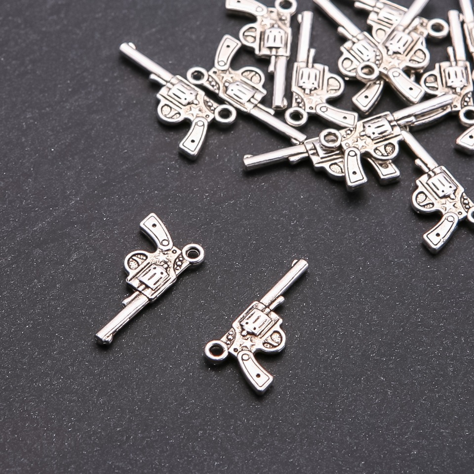 Pandantiv Nagan, diametru 1,8 mm, lungime 24×12 mm, ambalaj 20 g (+/-) 16 buc.