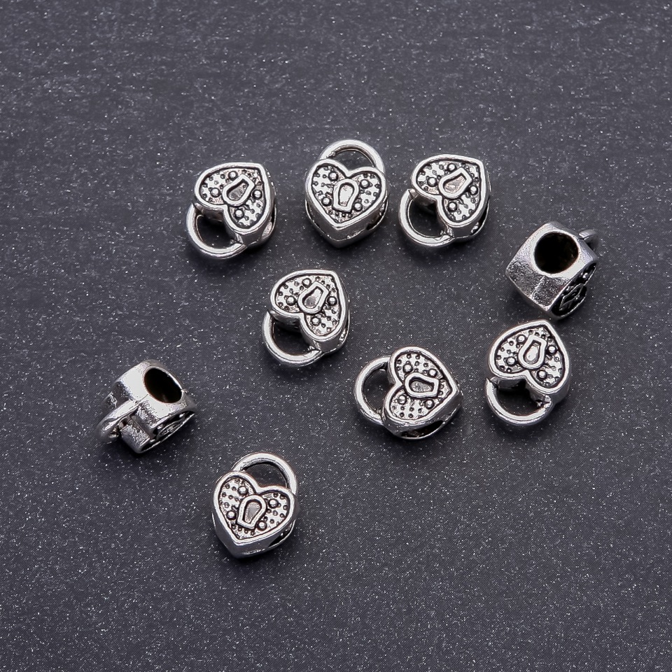 Mărgea Pandora inimă, diametru 10×12 mm, diametrul găurii 4,8 mm, 20 g +/- 9 buc