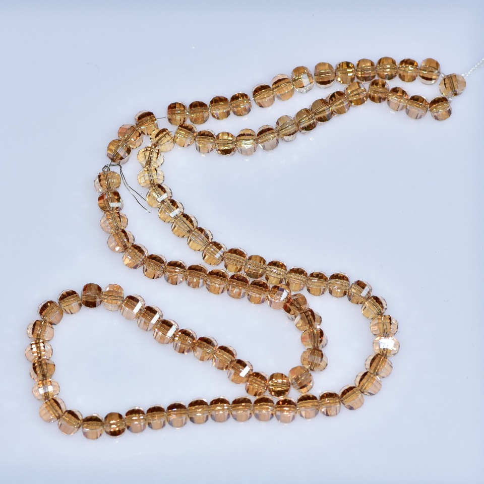 Perle de cristal în stil Swarovski, șampanie, globulețe tăiate, diametrul 5x4 mm, pe șnur de 48 cm