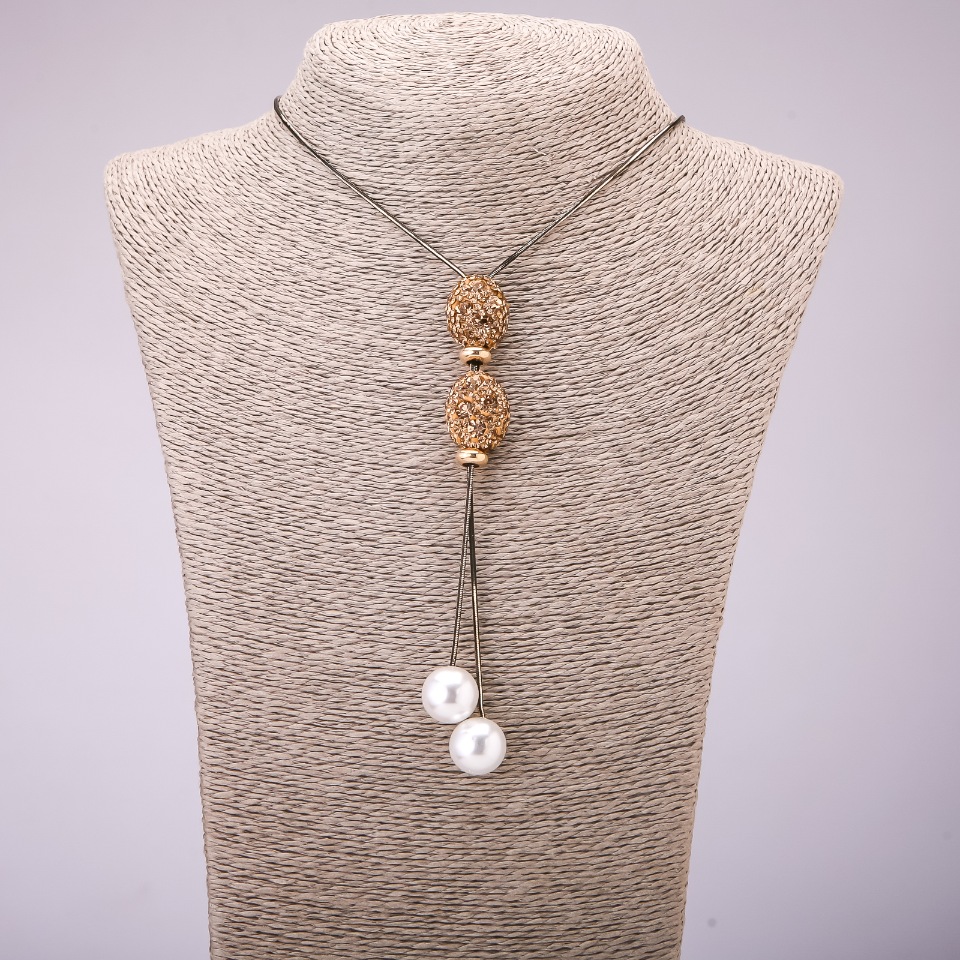 Pandantiv-cravată cu strasuri galbene pe un lanț lung din metal «aur negru», diametrul 16x48 mm, lungime 70 cm