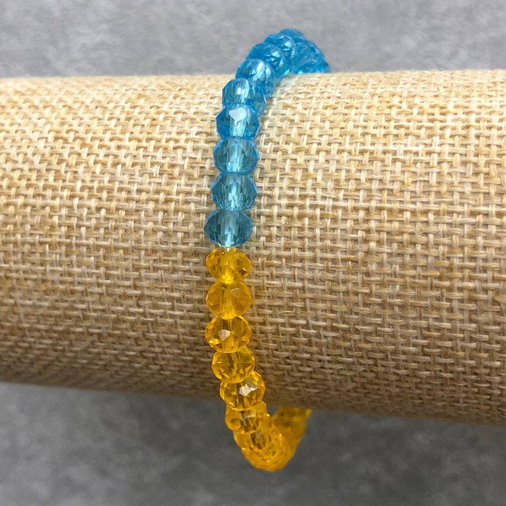 Brățară pe elastic din cristal ceh «Ucraina» cu rondel tăiat, diametrul 6x4 mm, lungime 18 cm